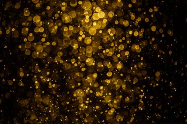 Görünür altın noktalı bulanık fotoğraf ışıl ışıl parlıyor. Duvar kağıdı olarak kullanılabilecek kadar lüks görünüyor.