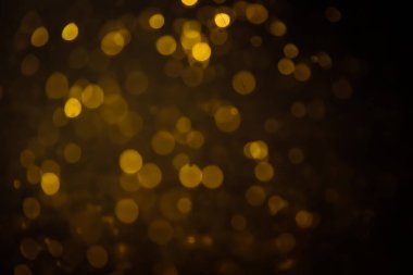 Görünür altın noktalı bulanık fotoğraf ışıl ışıl parlıyor. Lüks ve zevki gösteren bir duvar kağıdı olarak kullanılabilecek kadar lüks görünüyor..