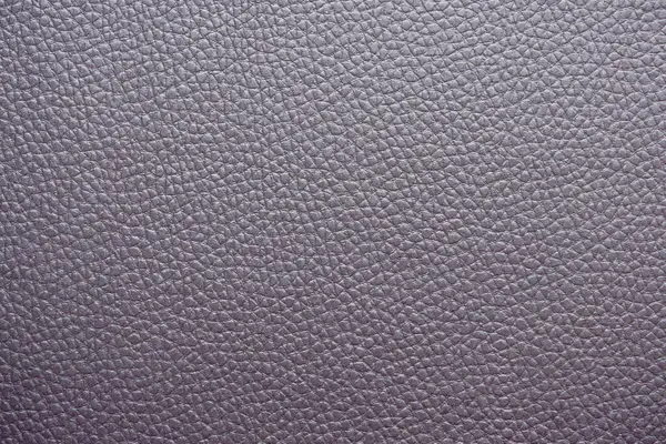 Yumuşak desenli Mor Deri 'nin yakın çekimi. Yüzey küçük, eşit aralıklı tahıllarla kaplı, pürüzsüz ve lüks bir görünüm sağlıyor. Nötr renk ve doğal doku onu çok yönlü bir arkaplan yapar.