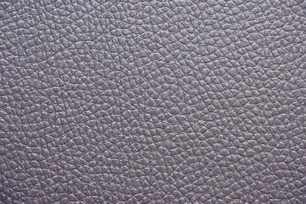 Yumuşak desenli Mor Deri 'nin yakın çekimi. Yüzey küçük, eşit aralıklı tahıllarla kaplı, pürüzsüz ve lüks bir görünüm sağlıyor. Nötr renk ve doğal doku onu çok yönlü bir arkaplan yapar.