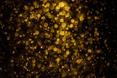 Görünür altın noktalı bulanık fotoğraf ışıl ışıl parlıyor. Duvar kağıdı olarak kullanılabilecek kadar lüks görünüyor.