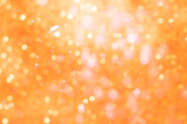 Turuncu soyut ışıltılar ya da parıltılı ışıklar Odaklanmamış daireler bokeh arkaplanı