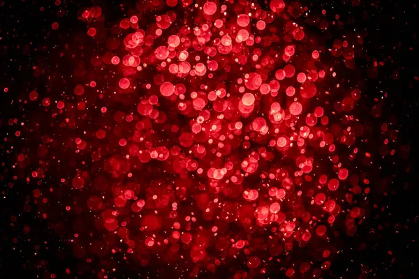 Görünür kırmızı noktalı bulanık fotoğraf, ışıl ışıl parlıyor. Duvar kağıdı olarak kullanılabilecek kadar lüks görünüyor.