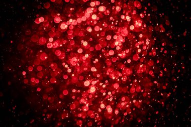 Görünür kırmızı noktalı bulanık fotoğraf, ışıl ışıl parlıyor. Duvar kağıdı olarak kullanılabilecek kadar lüks görünüyor.