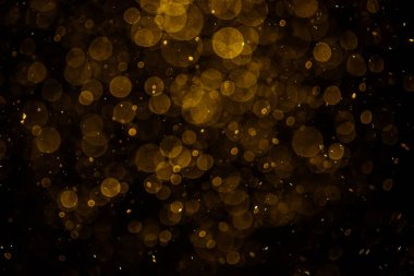 Görünür altın noktalı bulanık fotoğraf ışıl ışıl parlıyor. Duvar kağıdı olarak kullanılabilecek kadar lüks görünüyor.