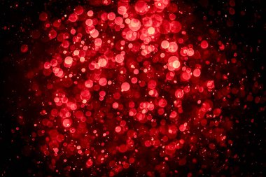 Görünür kırmızı noktalı bulanık fotoğraf, ışıl ışıl parlıyor. Duvar kağıdı olarak kullanılabilecek kadar lüks görünüyor.