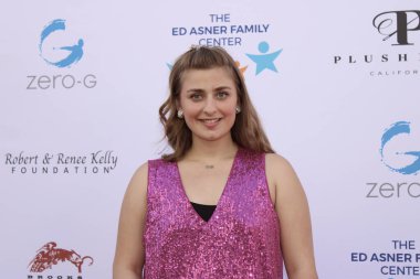 Studio City, CA - June 15, 2024: Abbey Romeo attends the Ed Asner Celebrity Poker to Benefit Autism research.