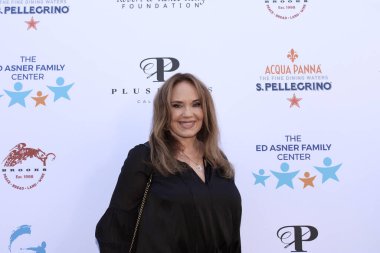 Studio City, CA - June 15, 2024: Catherine Bach attends the Ed Asner Celebrity Poker to Benefit Autism research.