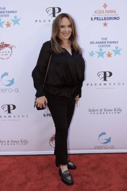 Studio City, CA - June 15, 2024: Catherine Bach attends the Ed Asner Celebrity Poker to Benefit Autism research.