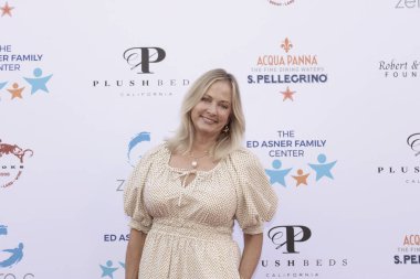 Studio City, CA - June 15, 2024: Cathy Podewell attends the Ed Asner Celebrity Poker to Benefit Autism research.
