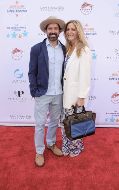 Studio City, CA - June 15, 2024: Chris Gialanella, publisher of Los Angeles Magazine, and his wife, Andrea Gialanella attend the Ed Asner Celebrity Poker to Benefit Autism research.