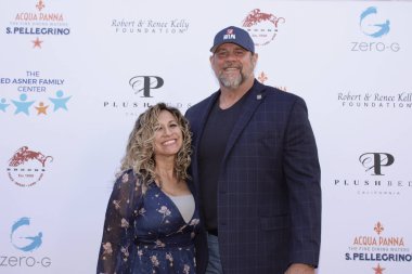 Studio City, CA - June 15, 2024: Dave Desrochers and Ann Marie Ochoa attend the Ed Asner Celebrity Poker to Benefit Autism research.