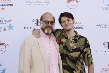 Studio City, CA - June 15, 2024: Fred Melamed and Lee Melamed attend the Ed Asner Celebrity Poker to Benefit Autism research.