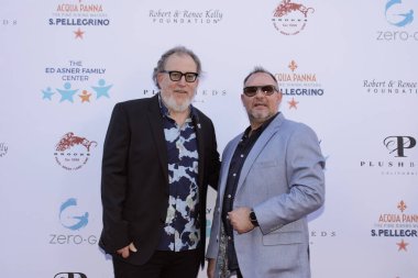 Studio City, CA - June 15, 2024: Matt Asner and Michel LeChasseur attend the Ed Asner Celebrity Poker to Benefit Autism research.