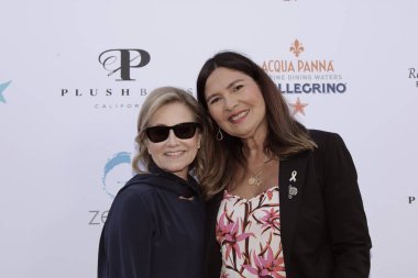 Studio City, CA - June 15, 2024: Maureen McCormick and Navah Paskowitz Asner attend the Ed Asner Celebrity Poker to Benefit Autism research.