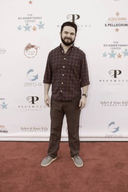 Studio City, CA - June 15, 2024: Samm Levine attends the Ed Asner Celebrity Poker to Benefit Autism research. clipart