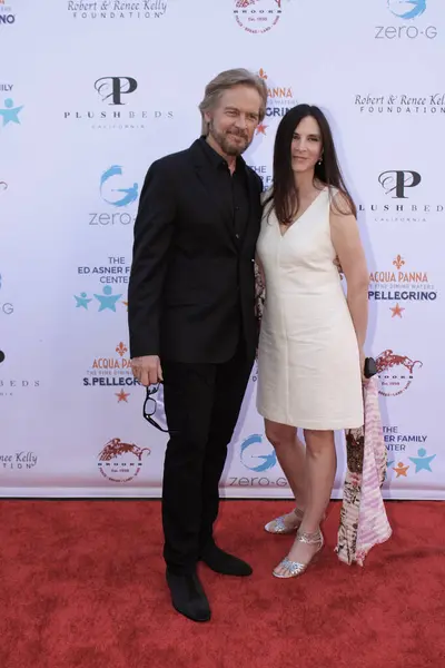 stock image Studio City, CA - June 15, 2024: Stephen Nichols and Lisa Nichols attend the Ed Asner Celebrity Poker to Benefit Autism research.