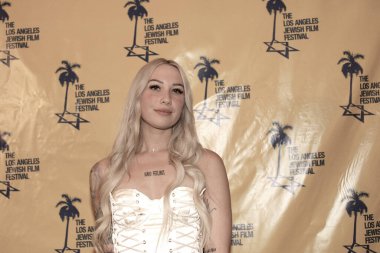 Beverly Hills, CA - June 19, 2024: Red carpet arrivals for the Jewish International Film Festival and premiere of Guns and Moses, an original film, held at the Saban Theater. clipart