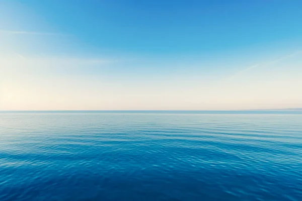 Stock image Blue sea with waves and sky with clouds.Calm tranquil blue sea vacation relaxing background with copy space