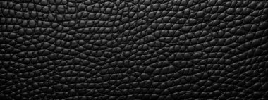 Siyah deri kaplama tasarım projeniz için zarif ve orijinal bir siyah doku kullanın. Lüks deri arka plan klasiği.