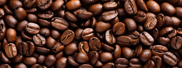 closeup roasted coffee beans, can be used as coffee products background used as a cafe or coffee product background