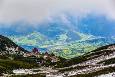 Alpine landscape in Rodnei Mountains. Photo taken from the Pietrosul Rodnei peak, Transylvania region, Romania on 1st of June 2020. clipart