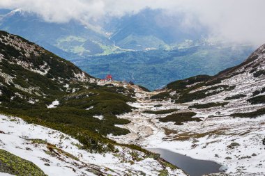 Alpine landscape in Rodnei Mountains. Photo taken from the Pietrosul Rodnei peak, Transylvania region, Romania on 1st of June 2020 clipart