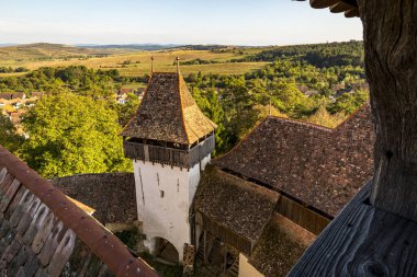 The medieval Saxon fortified church of Viscri seen from the tower bell. Photo taken on 2nd of October 2020 in Viscri, Transylvania region, Romania. clipart