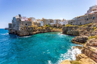 Beautiful view of Polignano a Mare, Metropolitan City of Bari, Apulia, Italy, showing seaside cliffs and historic buildings above turquoise water, captured on June 22, 2025.