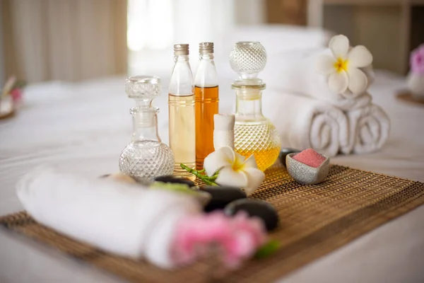 stock image The white linens and pink flower provide a clean and fresh feeling, while the  spa oil bottle helps to soothe the senses.