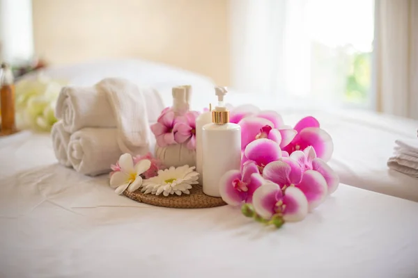 The lotion bottle adds a touch of luxury and indulgence to the spa composition making it a treat for the senses.