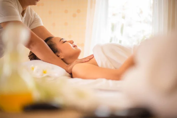 stock image Side view of beautiful asian customers being massaged by a professional masseuse.