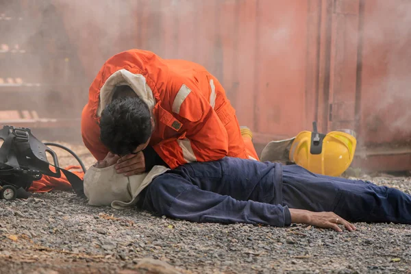 stock image Firefighters are performing rescue breaths to urgently rescue victims from the scene, Saving people.