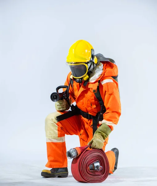 Stark White Backdrop Highlights Determined Presence Firefighter Kneel Adorned Helmet — Stock Photo, Image
