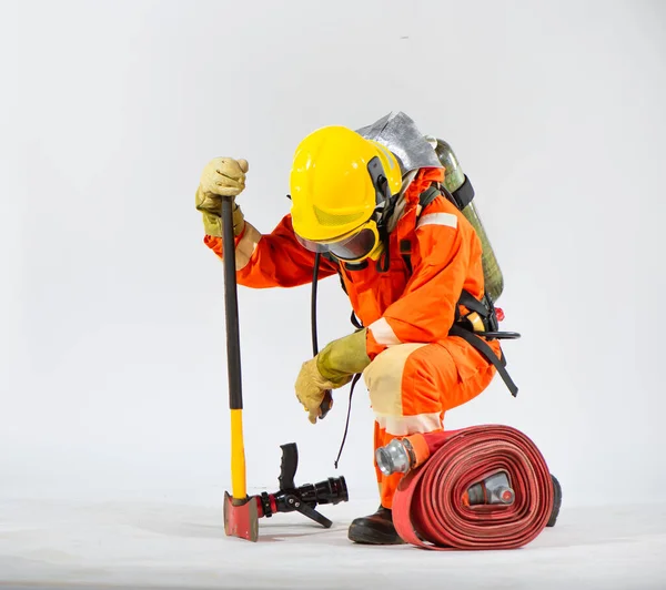 Brave Firefighter Kneels Firmly Gripping Iron Axe Oxygen Tank His — Stock Photo, Image