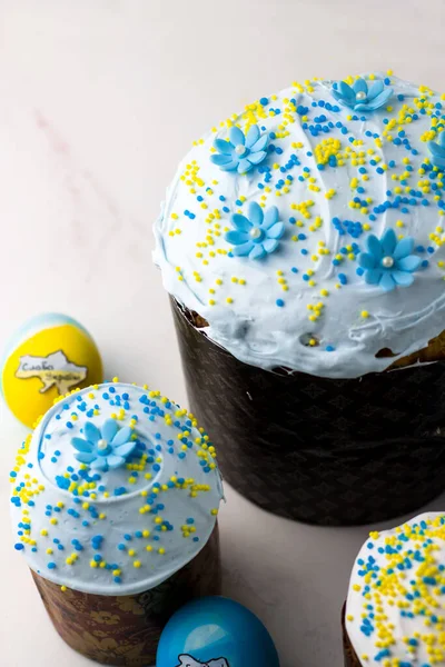 Patriotic paska and eggs in the colors of the flag of Ukraine. Blue and yellow eggs
