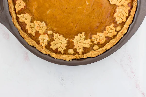 Decorating an autumn cake. Pumpkin pie. Seasonal delicacies