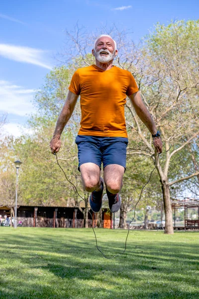 Active Senior Male Jumping Rope Determined Elderly Man Exercising Park — Stock Photo, Image