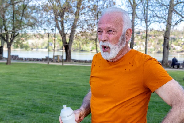 Exhausted Senior Man Catching His Breath Exercising Public City Park — Stock Photo, Image