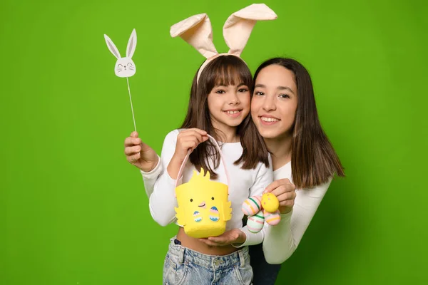 Happy easter family. Happy sister childhood concept. Girls bunny ears Funny little sister kids celebrate. Easter banner with copy space.