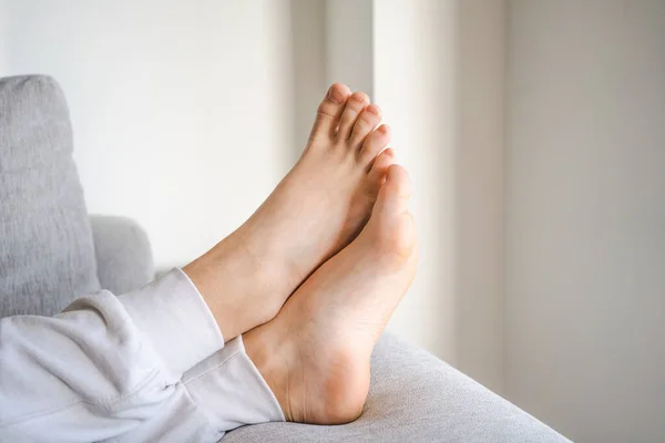 stock image Close up of boy foot lying on floor at home