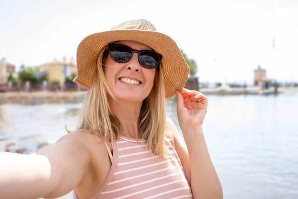 Close up portrait of Beach Woman in Sun Hat on Vacation