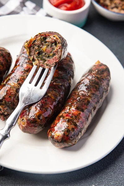 Stock image sausage fresh ground meat greens herbs pork, beef, chicken delicious snack healthy meal food snack on the table copy space food background rustic top view