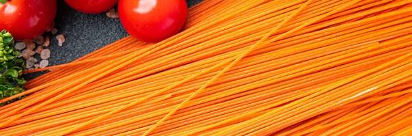 red tomato spaghetti raw pasta red dough pasta fresh healthy meal food snack on the table copy space food background rustic top view