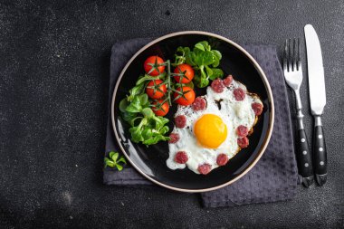 fried egg sausages, vegetable breakfast fresh meal food snack on the table copy space food background rustic top view