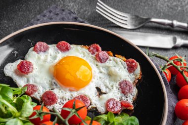 fried egg sausages, vegetable breakfast fresh meal food snack on the table copy space food background rustic top view