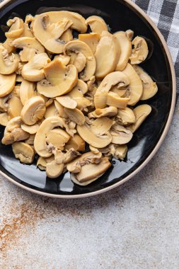 champignons slices mushrooms ready to eat healthy meal food snack on the table copy space food background rustic top view keto or paleo diet veggie vegan or vegetarian food