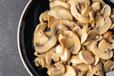 champignons slices mushrooms ready to eat healthy meal food snack on the table copy space food background rustic top view keto or paleo diet veggie vegan or vegetarian food