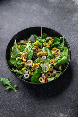 olive salad green mix lettuce leaves vegetable dish healthy meal food snack on the table copy space food background rustic top view keto or paleo diet veggie vegan or vegetarian food