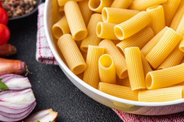 rigatoni raw pasta healthy meal food snack on the table copy space food background rustic top view
